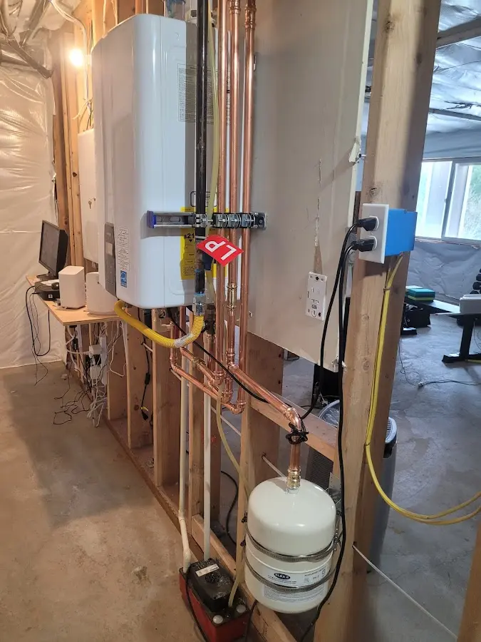 Licensed plumber repairing a kitchen sink in Madison